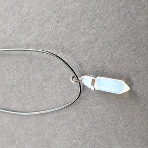 Clear crystal point pendant necklace on 16-inch faux leather chain